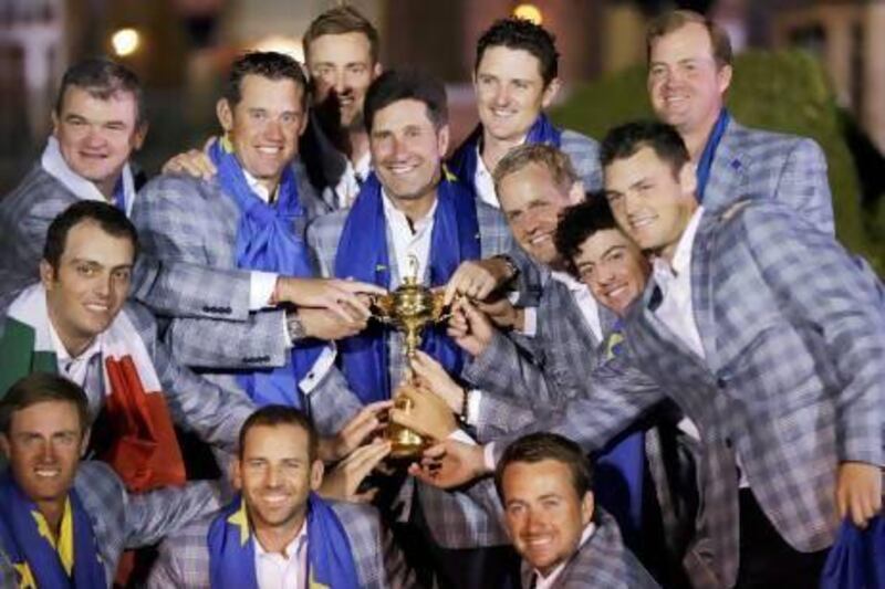 The European team poses with the Ryder Cup trophy after winning the tournament on September 30 at the Medinah Country Club in Illinois.
