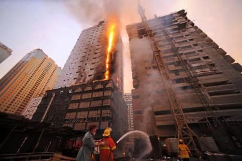 July 11, 2011-SHARJAH // Fire gutted a residential building that was still under construction in al Khan area just opposite Al Safeer Mall on Monday evening.

The 21 storeyed tower with five parking and 15 floors with a ground floor is owned by Rashid Ali Rashid Demas Al Suwaidy, the building was named Al Mansour and was being contracted by Demas and Ali Farhan Engineering and Contracting Company (DAFCO).
Yasin Kakande/The National 