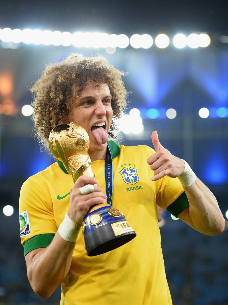 RIO DE JANEIRO, BRAZIL - JUNE 30:  David Luiz of Brazil celebrates with trophy after victory in the FIFA Confederations Cup Brazil 2013 Final match between Brazil and Spain at Maracana on June 30, 2013 in Rio de Janeiro, Brazil.  (Photo by Laurence Griffiths/Getty Images) *** Local Caption ***  172028710.jpg