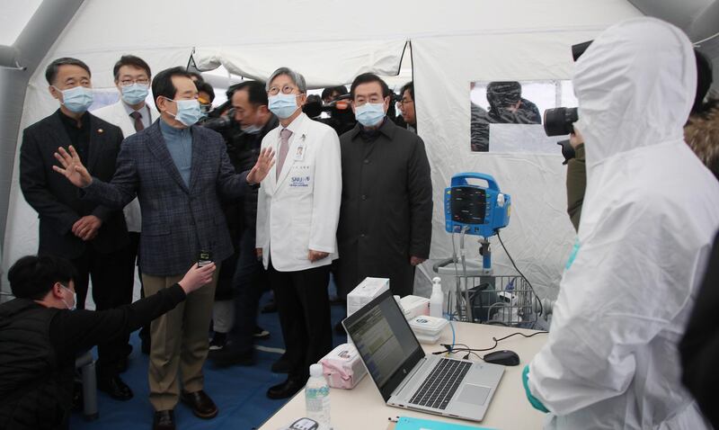 South Korea Prime Minister Chung Sye-kyun (3-L) visits a hospital, to see the hospital's quarantine efforts to prevent the spread of Wuhan coronavirus, in Seoul, South Korea.  EPA