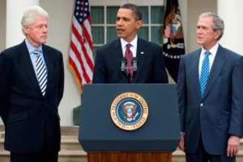 US President Barack Obama (C) speaks alongside former US Presidents Bill Clinton (L) and George W. Bush (R) about relief efforts following the earthquake in Haiti, during a statement in the Rose Garden of the White House in Washington, DC, on January 16, 2010. Obama said the former presidents would lead a fundraising effort for Haiti to aid the Caribbean nation after the devastating January 12 earthquake.      AFP PHOTO / Saul LOEB *** Local Caption ***  637703-01-08.jpg *** Local Caption ***  637703-01-08.jpg