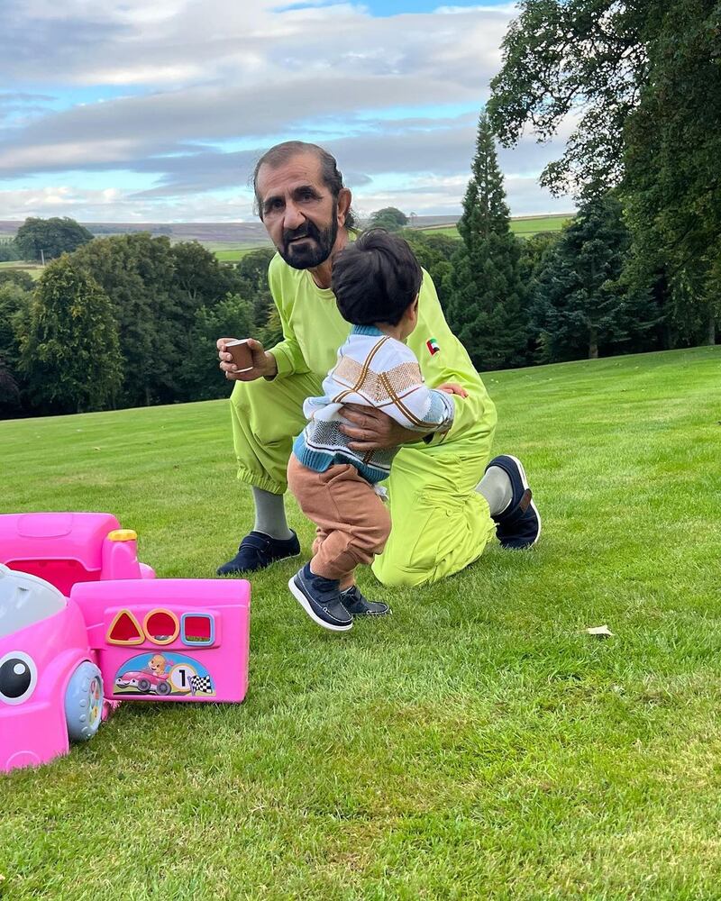 Sheikh Mohammed playing with his grandson Rashid.