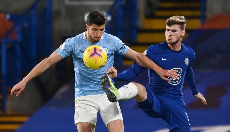 Chelsea's Timo Werner attemtps to tackle Ruben Dias of Manchester City. EPA