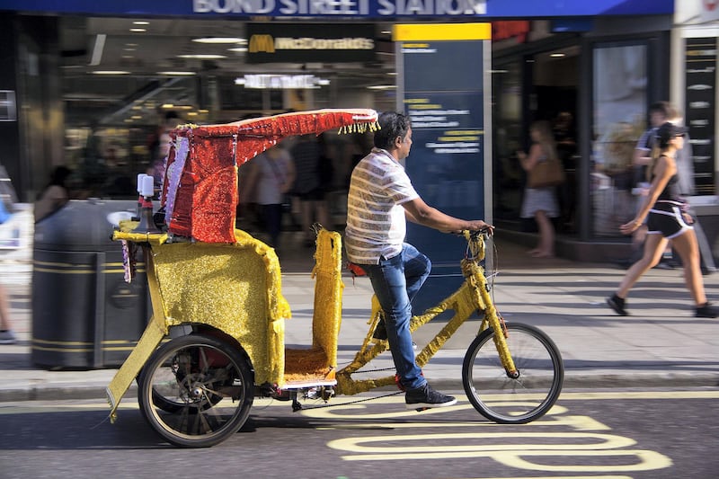 Bike taxi drivers come from across the world, including Turkey and south Asia. Shahzad Sheikh for The National