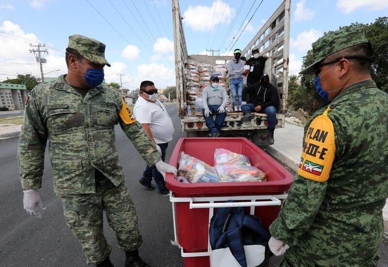 Members of the National Guard deliver supplies part of the health contingency due to COVID-19 in the country, in Cancun, Mexico.  EPA