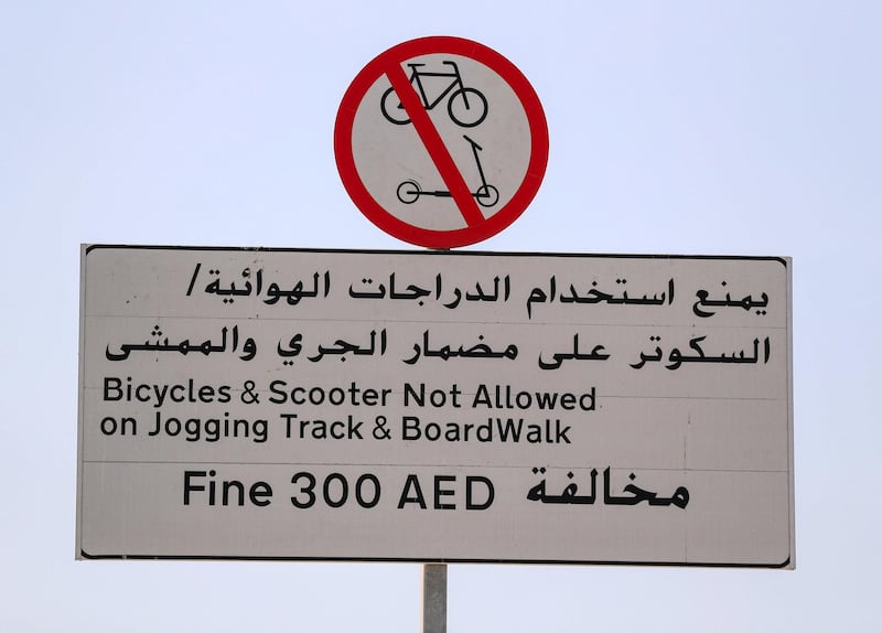 Signs on DubaiÕs KiteBeach warning people they will be fined if using a bike or a scooter on the jogging track on May 6th, 2021. Chris Whiteoak / The National. 
Reporter: Patrick Ryan for News