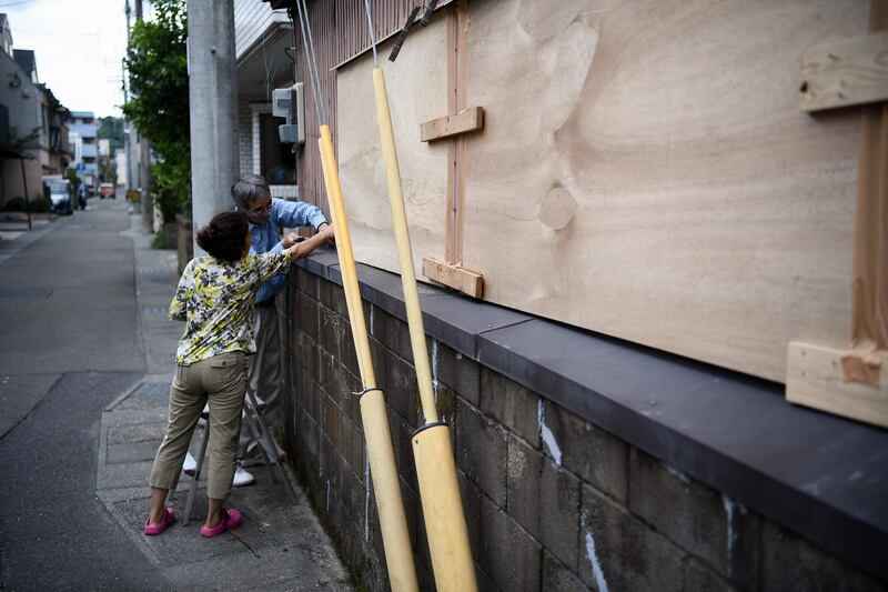 People barricade a house before Typhoon Haishen approaches in Kagoshima, Kagoshima prefecture.  AFP