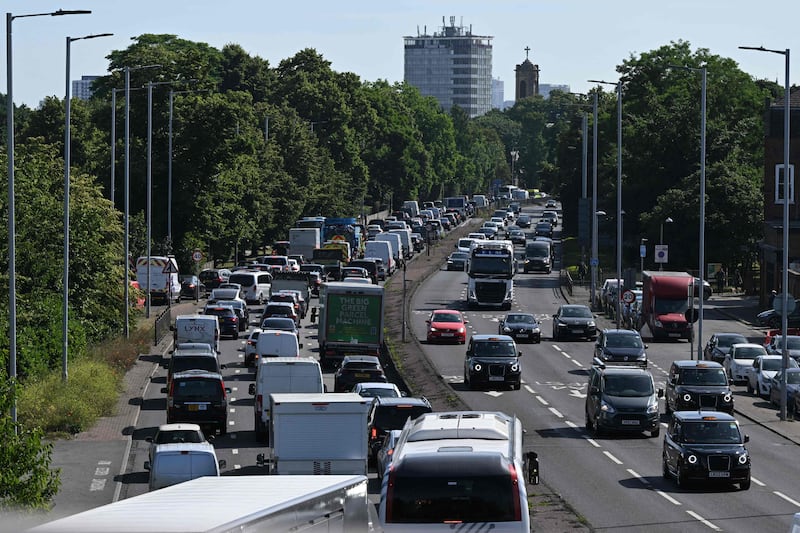 Cars queue in traffic in Hammersmith, west London, as commuters make their way to the city centre. AFP