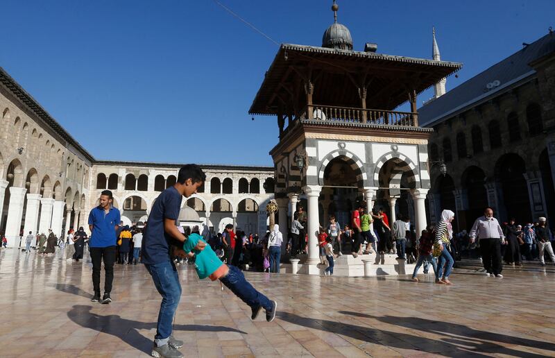 Syrians gather at the Umayyad Mosque in Damascus on the eve of the Prophet Mohammed's birthday.