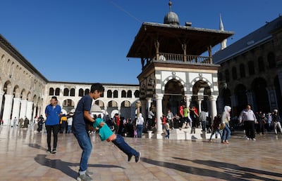 Syrians at the Umayyad Mosque in Damascus, on the eve of the birth of the Prophet Mohammed, October 18. AFP