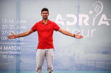 (FILES) In this file photo taken on May 25, 2020 Serbian tennis player Novak Djokovic (ATP Number 1) poses for photographers after a press conference on the upcoming Adria Tour tennis tournament in Belgrade. Novak Djokovic has also tested positive for coronavirus on June 23, 2020 along with Grigor Dimitrov, Borna Coric and Viktor Troicki, after taking part in an exhibition tennis tournament in the Balkans featuring world number one Novak Djokovic, raising questions over the sport's planned return in August. / AFP / Andrej ISAKOVIC