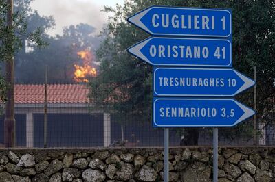 A fire rages through the countryside in Cuglieri, Sardinia.