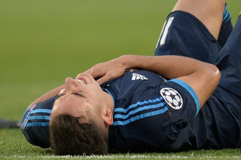 Real Madrid midfielder Lucas Vazquez lies on the pitch after being hurt by a clearance. Oli Scarff / AFP