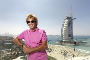 Pimlico Plumbers founder Charlie Mullins, with Dubai's Burj Al Arab in the background. The British businessman is looking to expand into the emirate. Antonie Robertson / The National