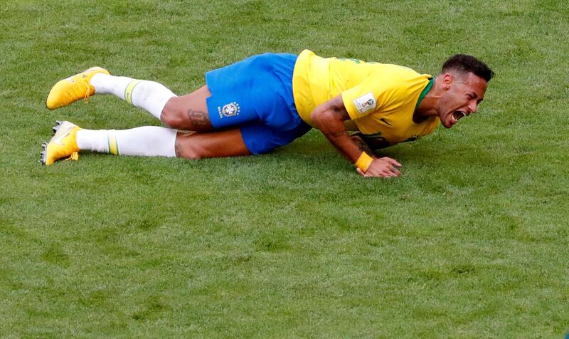 Neymar hits the deck during the last 16 match against Mexico. David Gray / Reuters