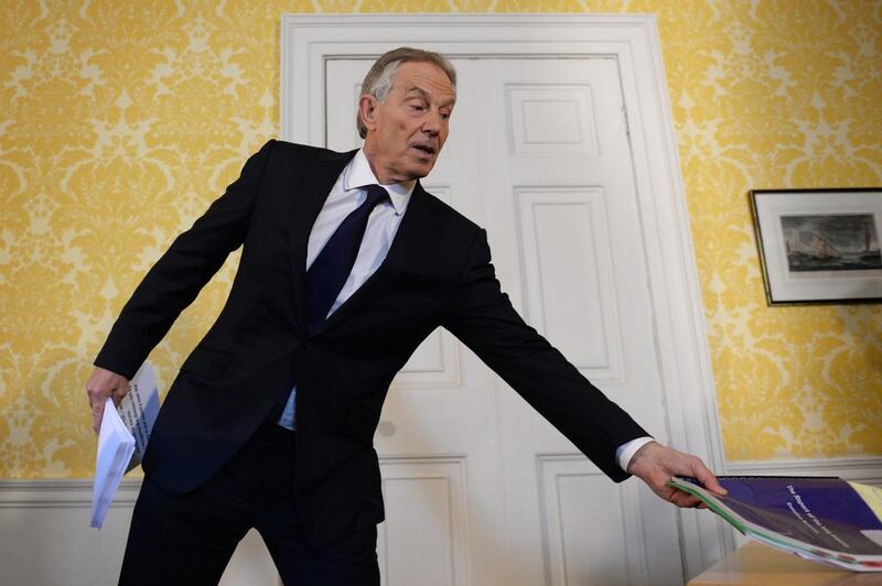 Tony Blair with a copy of the Chilcot report. The chilling effect of his actions in Iraq will affect western policymakers for many years. (Photo by Stefan Rousseau - WPA Pool/Getty Images)