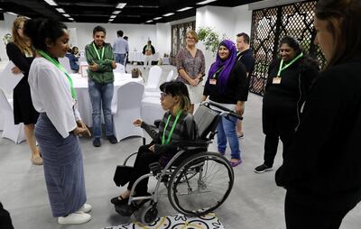 ABU DHABI , UNITED ARAB EMIRATES , February 27 – 2019 :- Noura Farag ( on the wheel chair ) getting training as a Volunteers with disabilities for the Special Olympics games at the Abu Dhabi Media Company in Abu Dhabi. ( Pawan Singh / The National ) For News. Story by Ramola