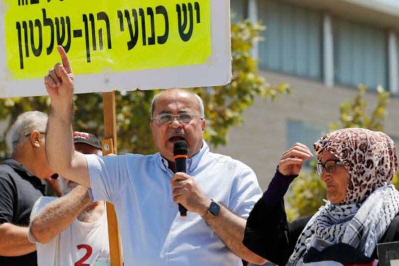 Knesset member Ahmad Tibi speaks at a demonstration by Palestinian, Israeli and foreign activists against Israeli occupation and settlement activity. The protest was held outside the Supreme Court in Jerusalem as it convened to rule on the eviction of Palestinian families from their homes in Sheikh Jarrah in the east of the city.