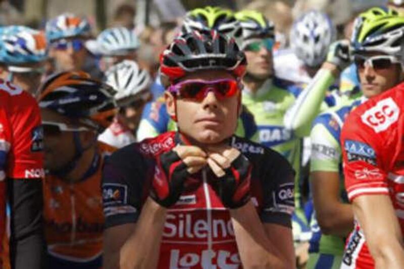 Cadel Evans of Australia adjusts his helmet as he waits to take the start of the first stage of the Tour de France