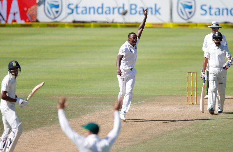 South African bowler Kagiso Rabada (2nd from R) celebrates the dismissal of Indian batsman Hardik Pandya (L) during the second day of the first Test cricket match between South Africa and India at Newlands cricket ground on January 6, 2018 in Cape Town.  / AFP PHOTO / GIANLUIGI GUERCIA