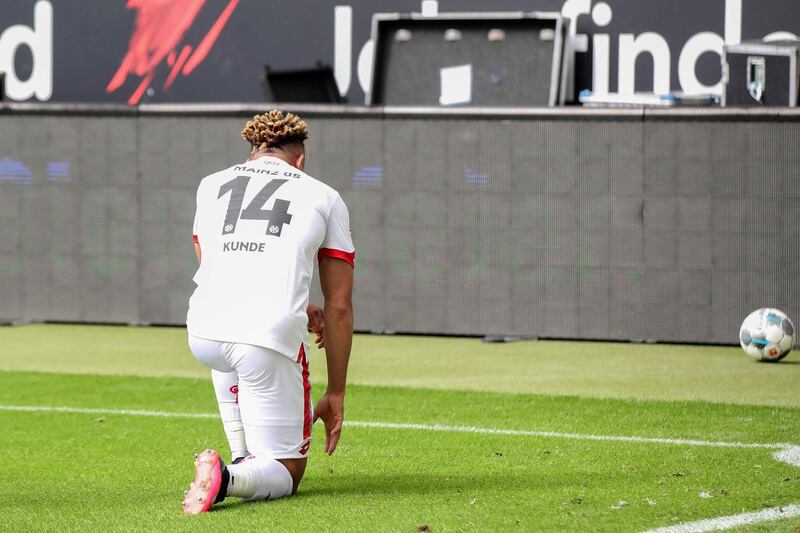 Mainz midfielder Kunde Malong take a knee in solidarity with protests taking across the United States over the death of George Floyd. AFP
