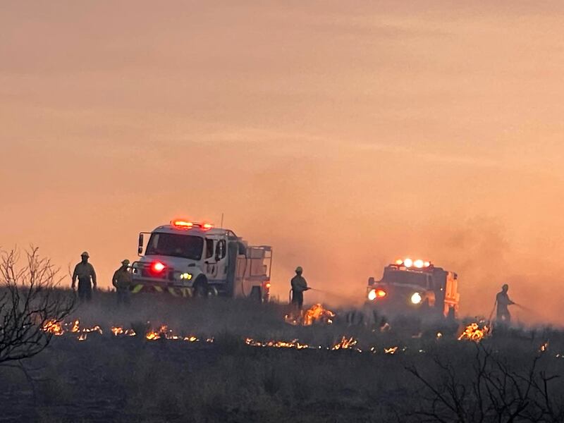 Amarillo firefighters during clean-up operations from the Windy Deuce fire, north of Amarillo. AFP