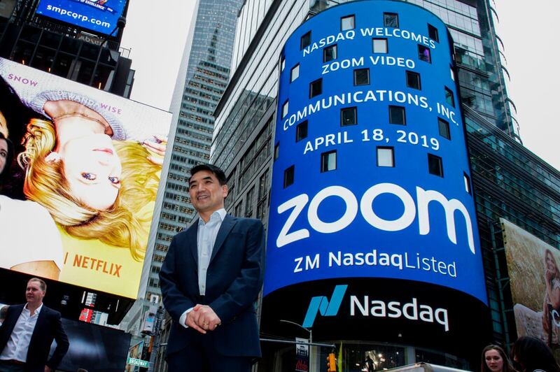 (FILES) In this file photo Zoom founder Eric Yuan poses in front of the Nasdaq building as the screen shows the logo of the video-conferencing software company Zoom after the opening bell ceremony on April 18, 2019 in New York City. Zoom shares soared on August 31 after the video-meeting service reported that quarterly revenue rocketed as its ranks of users more than quadrupled. / AFP / GETTY IMAGES NORTH AMERICA / KENA BETANCUR
