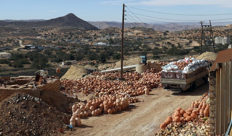 Ceramic pots dry in the sun at a workshop in Gharyan.