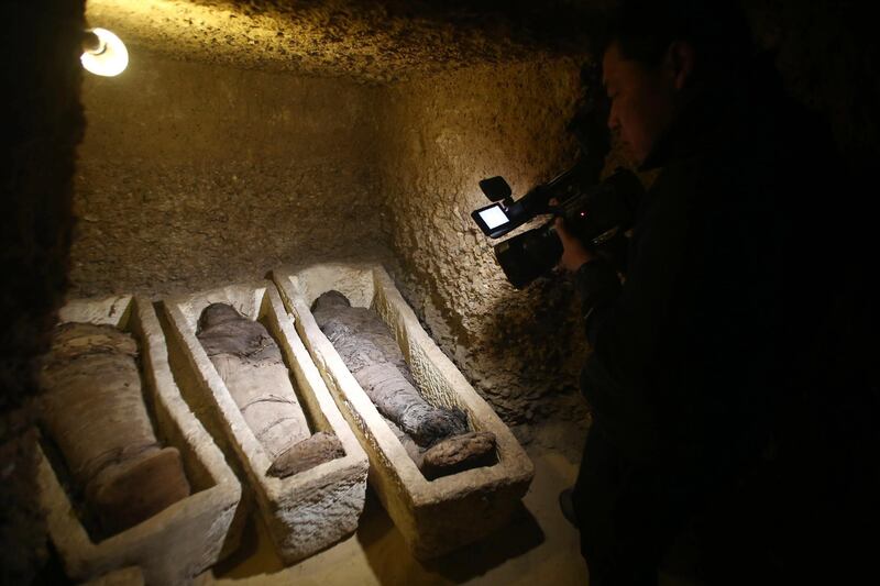 A videographer shoots mummies found at Tuna el-Gebel, Egypt. EPA