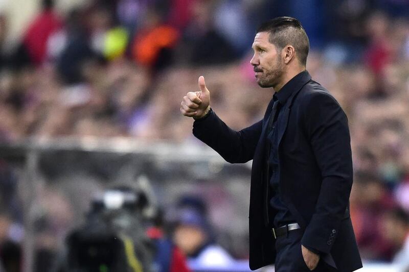 Atletico Madrid coach Diego Simeone gestures during his side's scoreless draw with Chelsea on Tuesday in the Champions League. Javier Soriano / AFP / April 22, 2014
