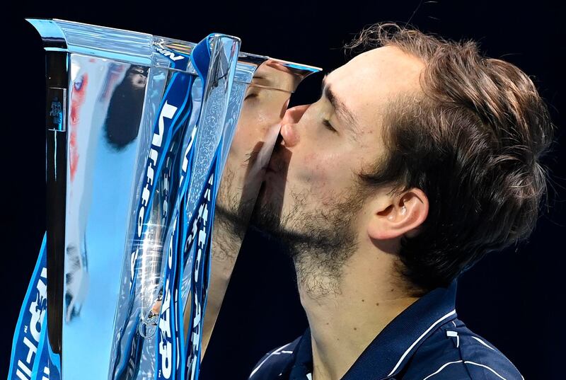 Daniil Medvedev kisses the ATP Finals trophy. EPA