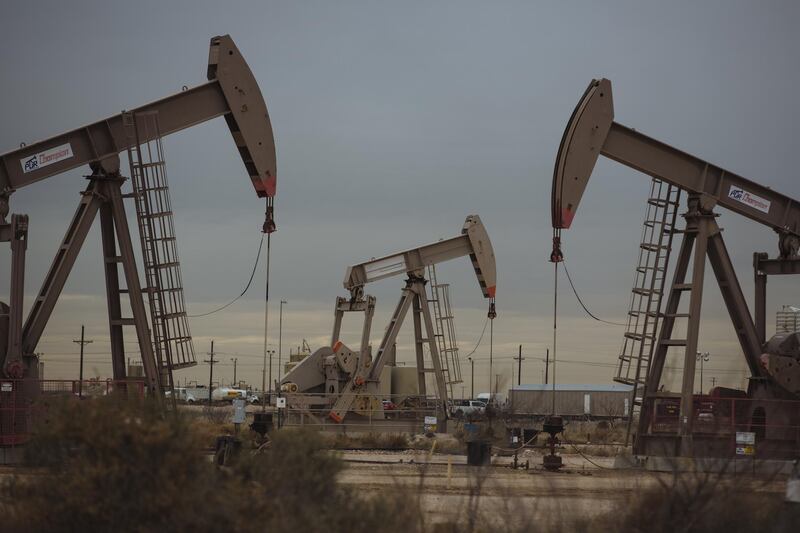 Pump Jacks extract crude oil from oil wells in Midland, Texas, U.S., on Monday, Dec. 17, 2018. Once the shining star of the oil business, gasoline has turned into such a drag on profits that U.S. refiners could be forced to slow production in response. Photographer: Angus Mordant/Bloomberg