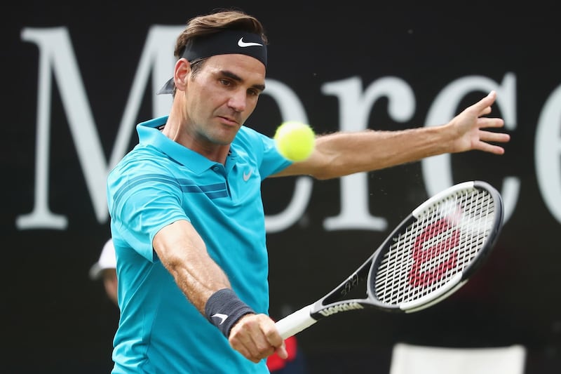 STUTTGART, GERMANY - JUNE 16:  Roger Federer of Switzerland plays a backhand to Nick Kyrgios of Australia during day 6 of the Mercedes Cup at Tennisclub Weissenhof on June 16, 2018 in Stuttgart, Germany.  (Photo by Alex Grimm/Getty Images)