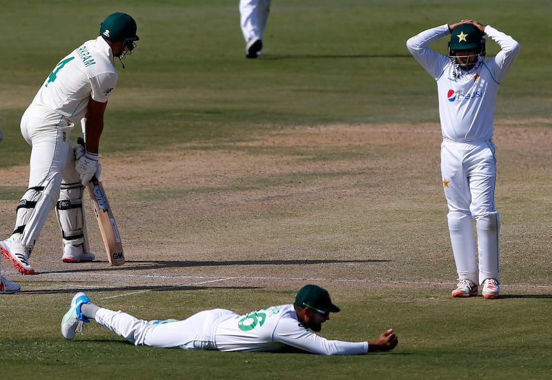 Pakistan captain Babar Azam, on ground, after dropping a catch off South Africa batsman Aiden Markram at the National Stadium in Karachi. AP