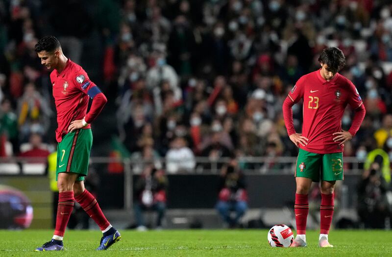 Portugal's Cristiano Ronaldo, left, and Joao Felix react. AP Photo
