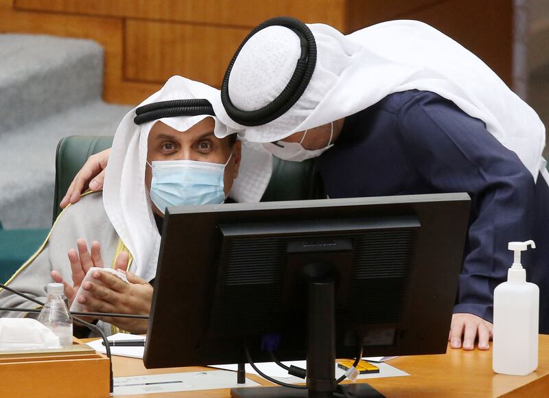 Kuwait's Defence Minister Sheikh Hamad Jaber Al Ali, left, listens to Foreign Minister Sheikh Ahmad Nasser Al Mohammad Al Sabah at the National Assembly in Kuwait City on January 18. AFP