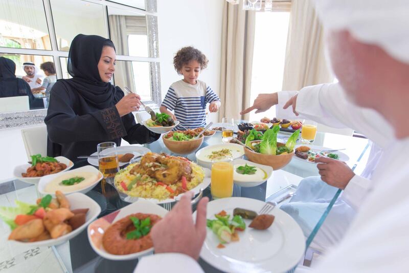 Family eating traditional arabic Mezze. Getty Images