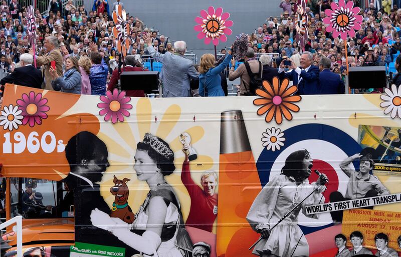 Performers on the 1960s bus take part in the Platinum Pageant. AFP