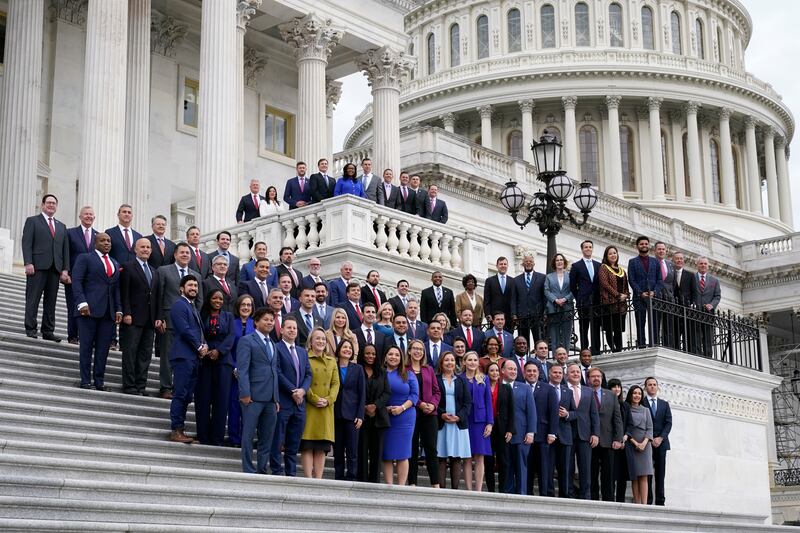 Newly-elected members of the US Congress pose on the steps of the Capitol building in Washington. AP