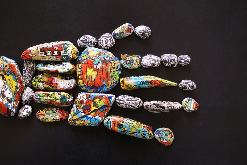 The 'stone man' pushed mediums to their limits. Stones in shape of Hand 2013, Acrylic on Stones. Photo: Ismail Khayat Gallery