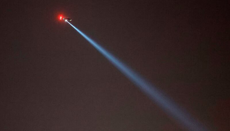 A helicopter hovers over the I-540 motorway in Raleigh. AP