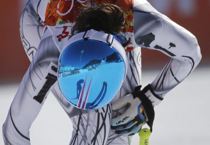 Spain's Carolina Ruiz Castillo takes off her skis after a women's downhill training run for the Sochi 2014 Winter Olympics on Friday. Christophe Ena / AP  
