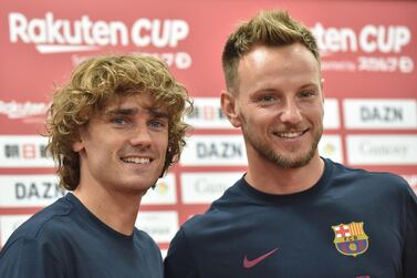 Barcelona's French forward Antoine Griezmann (L) and Croatian midfielder Ivan Rakitic (R) pose for photos after a pre-match press conference ahead of their Rakuten Cup football match with Chelsea, in Machida, suburban Tokyo on July 22, 2019. / AFP / Kazuhiro NOGI
