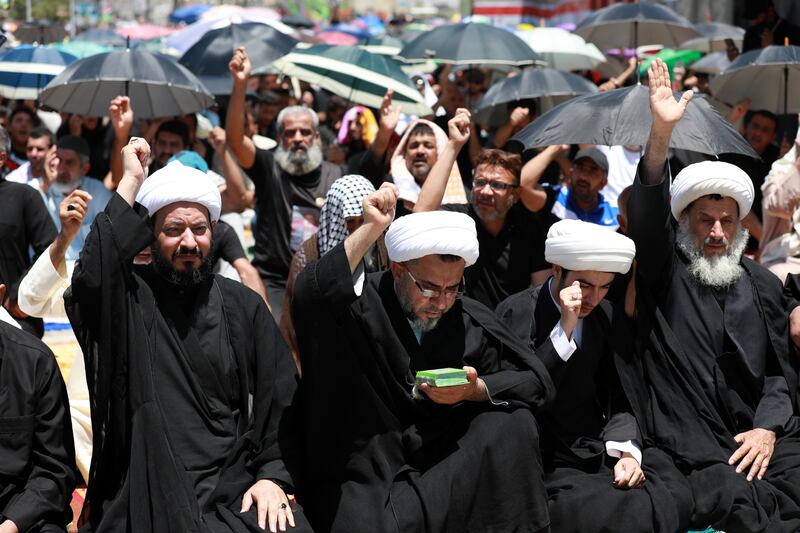 Shiite clerics attend a protest in Baghdad, after Iraq called for an Islamic summit to discuss the desecration of the Quran. EPA