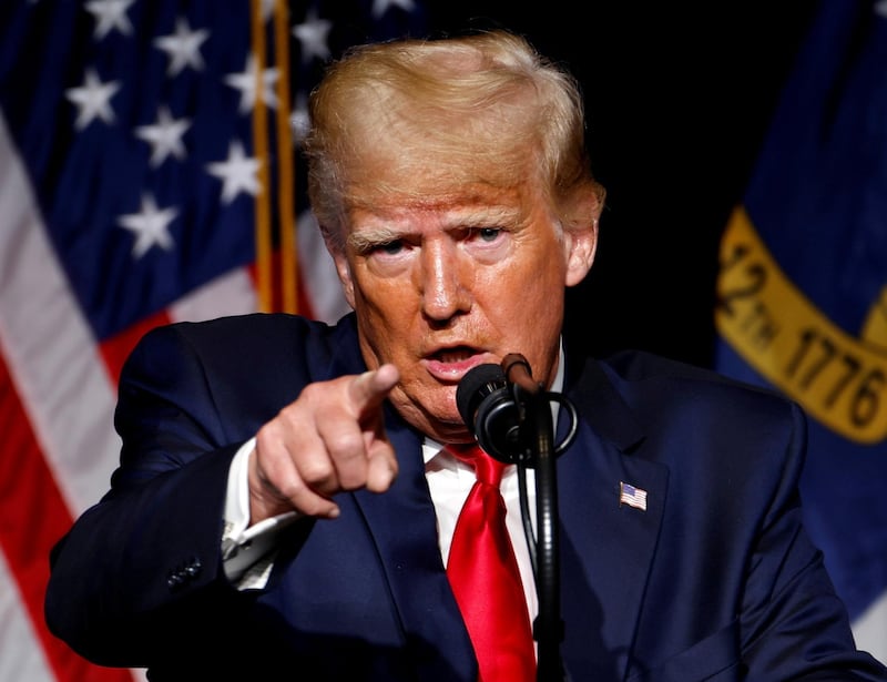FILE PHOTO: Former U.S. President Donald Trump points at the media while speaking at the North Carolina GOP convention dinner in Greenville, North Carolina, U.S. June 5, 2021.  REUTERS/Jonathan Drake/File Photo