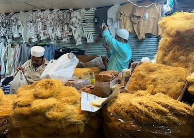 Shopkeeper selling sewaiyan, or vermicelli, a popular fine ‘noodle-like’ dessert that is quintessential for sehri in the subcontinent. It is roasted in clarified butter and soaked or boiled in milk. Taniya Dutta/The National