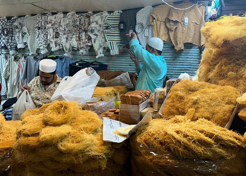 Shopkeeper selling sewaiyan, or vermicelli, a popular fine ‘noodle-like’ dessert that is quintessential for sehri in the subcontinent. It is roasted in clarified butter and soaked or boiled in milk. 