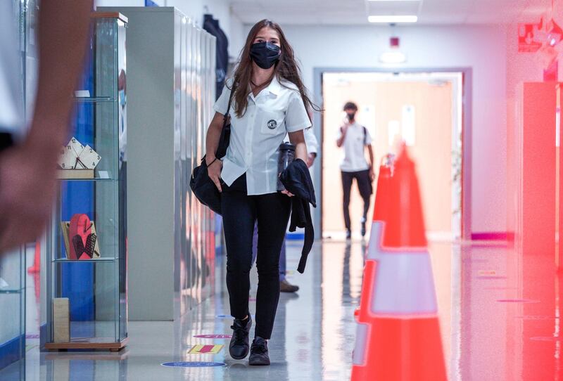 Abu Dhabi, United Arab Emirates, September 28, 2020.  First day back to classes on the reopening of British School Al Khubayrat, with Covid-19 protocols for the safety of  students, faculty and parents.  The students are given a Covid-19  campus traffic rules tour by the teachers. Victor Besa/The National
Section:  NA
Reporter:  Haneen Dajani