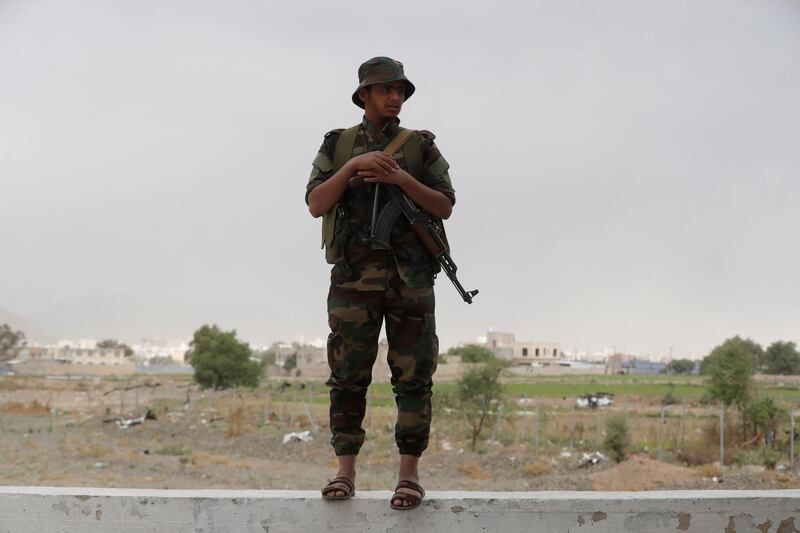 epa09148244 A Houthi fighter stands guard at a square as the country’s intensified fighting continues, in Sana'a, Yemen, 20 April 2021. Despite the UN Security Council has called for immediate military de-escalation in the oil-producing Yemeni province of Marib, the Houthis continued their intensified offensive on the government-held province, leading to large waves of displacement since the start of the escalation in early February.  EPA/YAHYA ARHAB