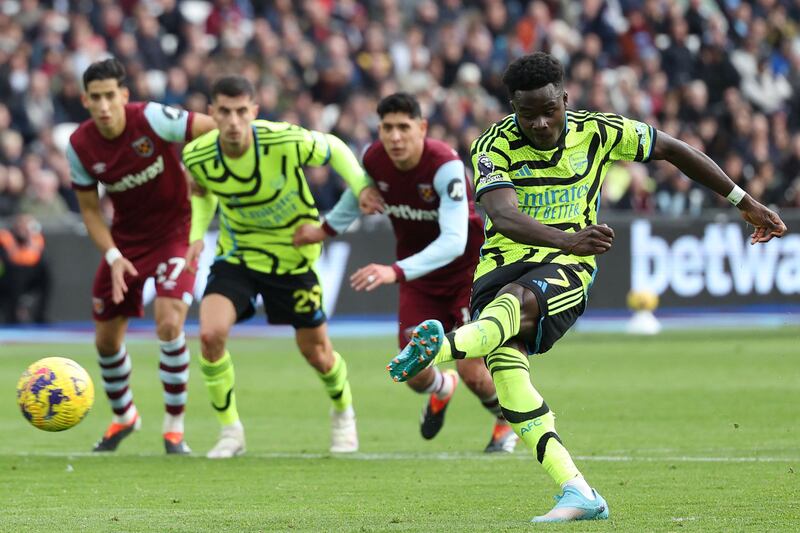 Bukayo Saka scores Arsenal's second goal from the penalty spot. AFP